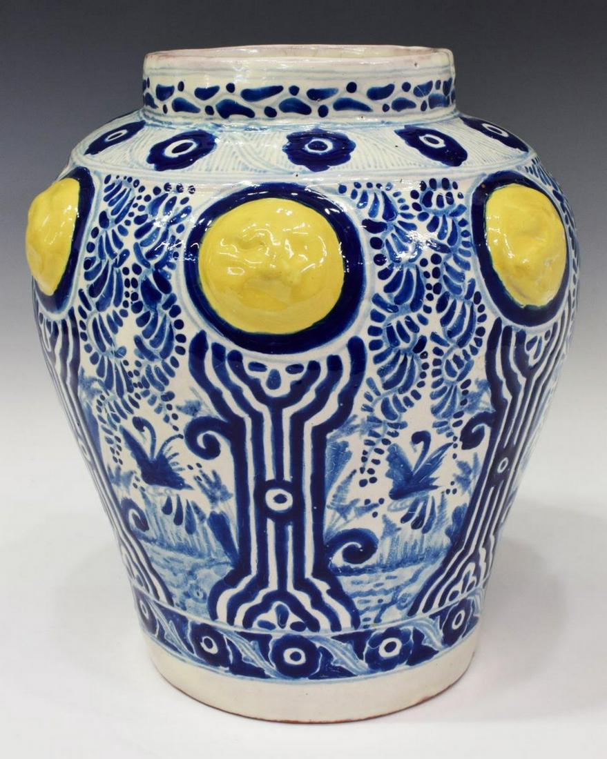 URIARTE TALAVERA TIN-GLAZED EARTHENWARE VASE: Uriarte Talavera tin-glazed earthenware vase, Puebla Mexico, with blue floral motif, approx 12"h, 11"diam, 10.4 lbs Start Price: $100.00