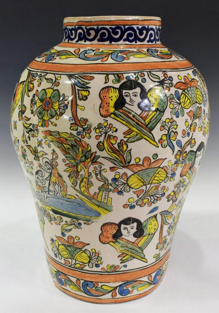 URIARTE TALAVERA TIN-GLAZED EARTHENWARE VASE: Uriarte Talavera tin-glazed earthenware vase, Puebla, Mexico, with figural angel and foliate motif, signed Uriarte, Pue. Mex. X 84 P5029, approx 17"h, 12"diam, 13 lbs Start Price: $100.00