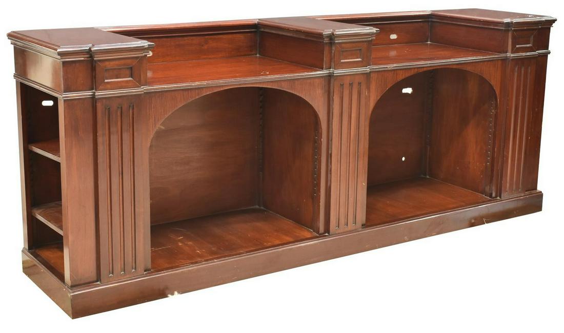 VINTAGE MAHOGANY CREDENZA: Vintage mahogany credenza, 20th c., long rectangular case with two recessed surfaces, fluted pilasters, central arcaded openings with shelf supports, additional shelving at sides, rising on a plinth b