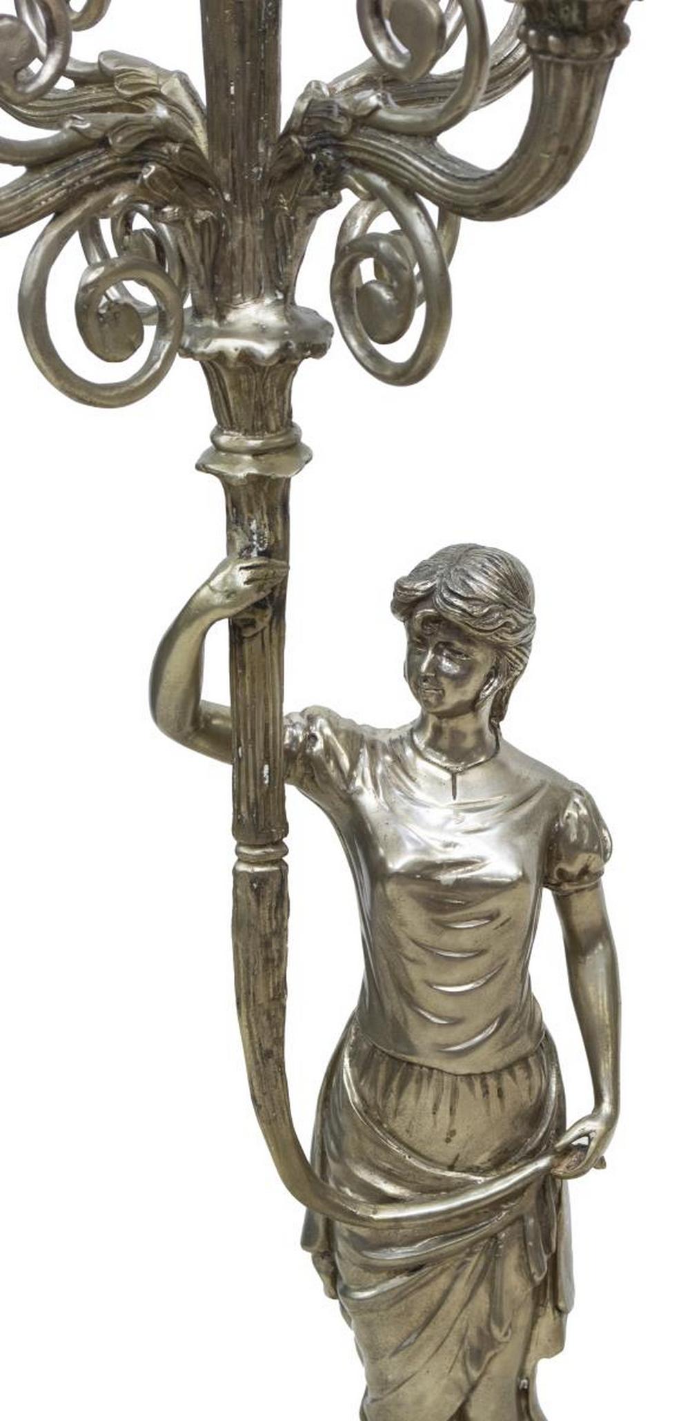 FRENCH EMPIRE STYLE SILVERED BRONZE CANDELABRUM: French Empire style silvered bronze four-light candelabrum, 20th c., held by a female figure on integral stand, the shaped base with ram's head at each corner, rising on hoof feet, approx 43"h, 13.5"w
