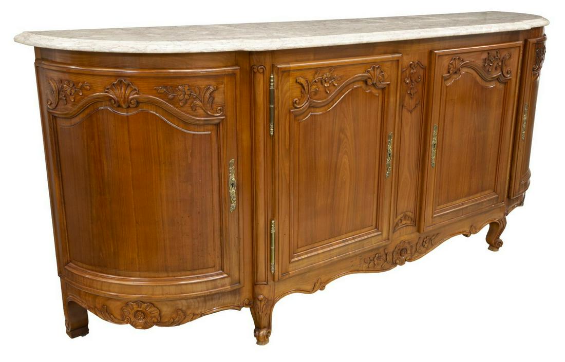 FRENCH LOUIS XV STYLE FRUITWOOD SIDEBOARD: French Louis XV style fruitwood sideboard, early 20th c., having a shaped marble top, over four cabinets, opening to shelved interior, shell and foliate carving throughout, rising on cabriole legs, en