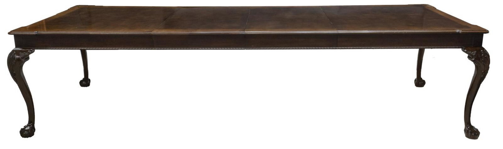 HENREDON CHIPPENDALE STYLE FLAME MAHOGANY TABLE: Chippendale style flame mahogany extension dining table, Henredon, 20th c., banded top, over two frieze drawers with lined interiors for flatware, rising on cabriole legs with foliate carved knees, en