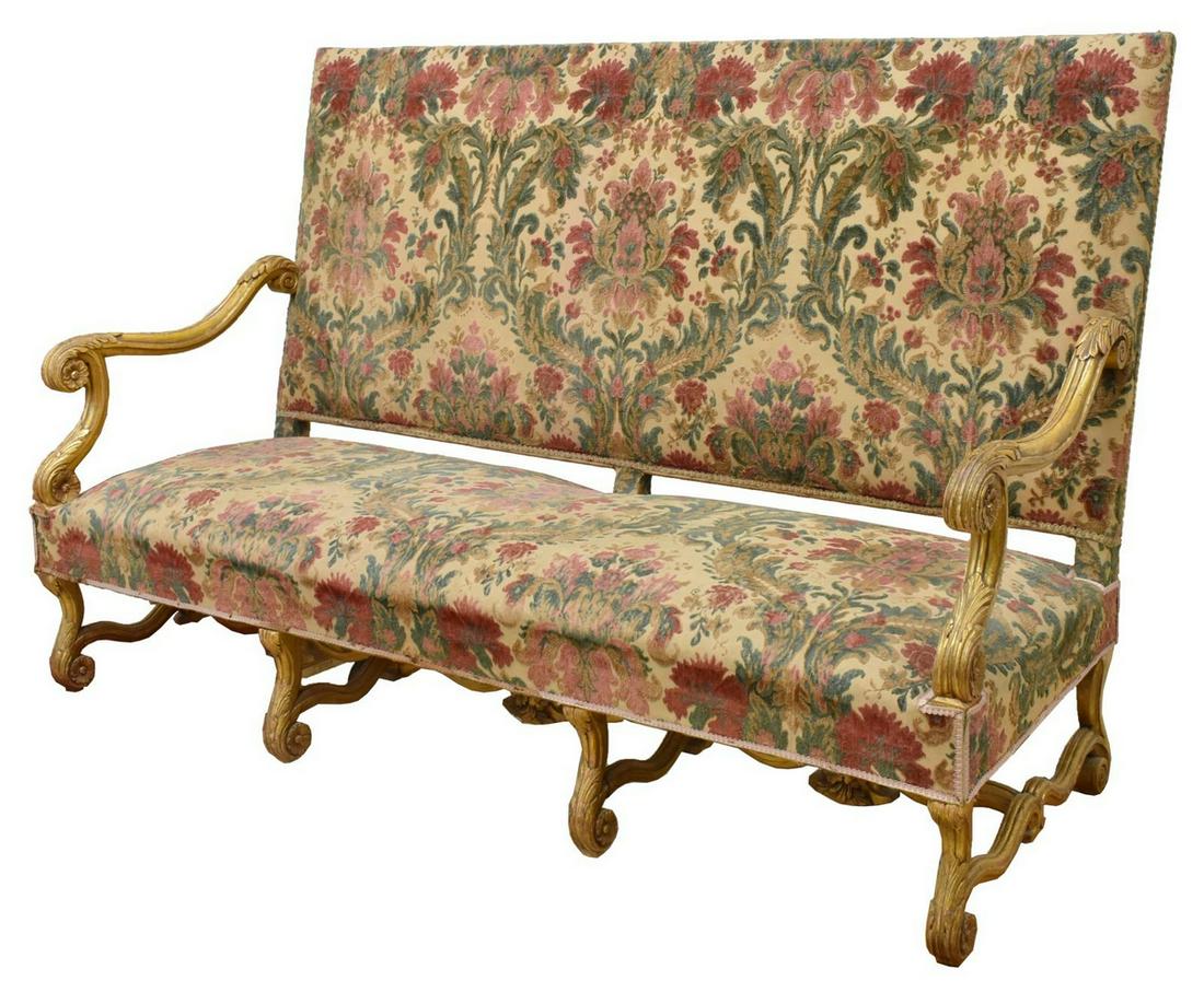 FINE FRENCH LOUIS XIV STYLE GILTWOOD SOFA SETTEE: French Louis XIV style sofa, giltwood frame with scrolled acanthus arms, upholstered high back over bench seat, rising on volute supports, joined by H stretcher with floral carving, approx 44.25"h, 71