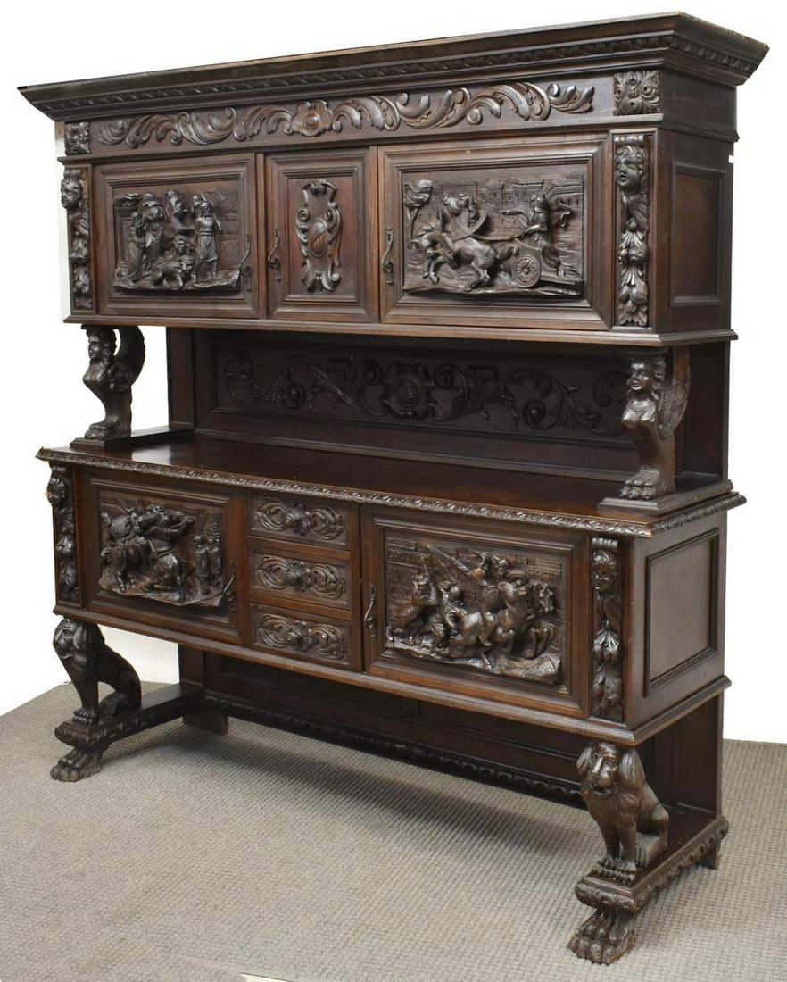 RENAISSANCE REVIVAL FIGURAL CARVED LION SIDEBOARD: Italian Renaissance Revival carved walnut sideboard, early 20th c., a carved cornice over acanthus decorated frieze, upper and lower case featuring drawers and doors, all carved with figural pendants,