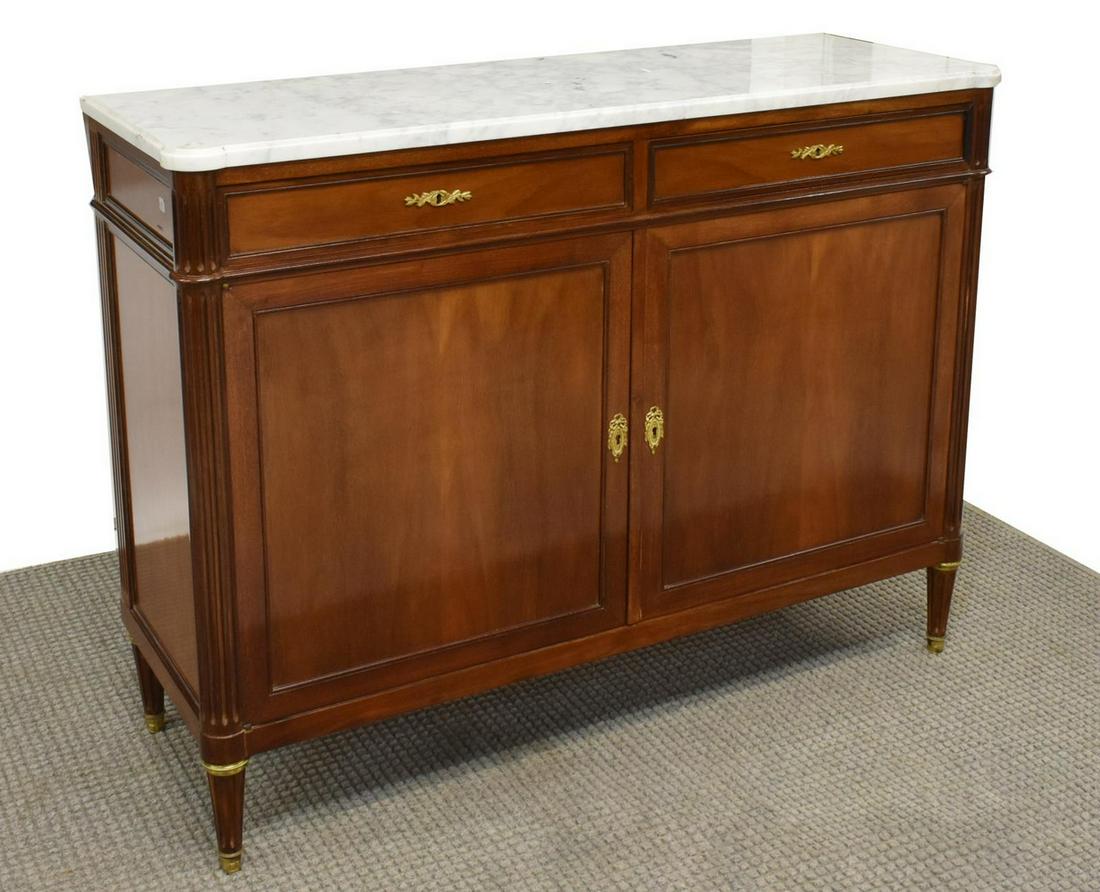 LOUIS XVI STYLE MARBLE-TOP MAHOGANY SIDEBOARD: French Louis XVI style mahogany sideboard, 20th c., having a marble top, over case fitted with two drawers, two cabinet doors with gilt metal escutcheons, rising on fluted tapered legs, approx 39.5"h,