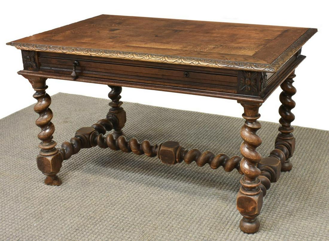 FRENCH HENRI II STYLE OAK WRITING DESK, 19TH C.: French Henri II style oak writing desk, 19th c., having rectangular top, scalloped carved border, over single frieze drawer, with hanging pulls, rising on stretcher-joined spiral twist legs, on turned