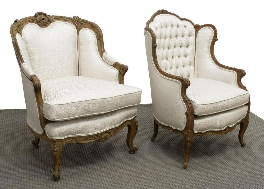 (2) LOUIS XV STYLE UPHOLSTERED WINGBACK BERGERES: (lot of 2) Louis XV style wingback armchairs, similarly styled, 20th c., wood frame with floral carving, loose seat cushion, rising on cabriole legs, (one) with button-tufted back, approx 40.5"h, 28"w