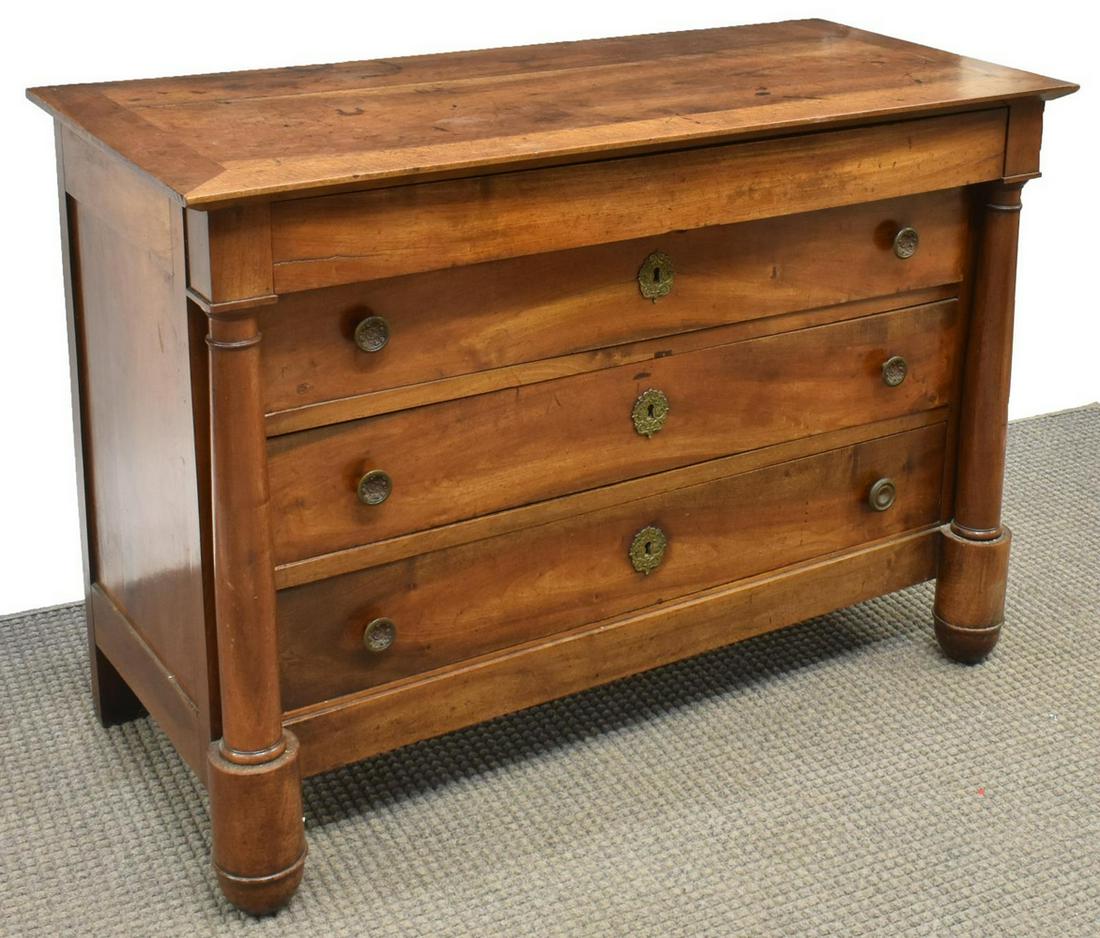 FRENCH EMPIRE STYLE FOUR-DRAWER COMMODE: French Empire style commode, 19th c., four drawers flanked by columns descending to shaped supports, approx 34.5"h, 49"w, 22.5"d Start Price: $350.00