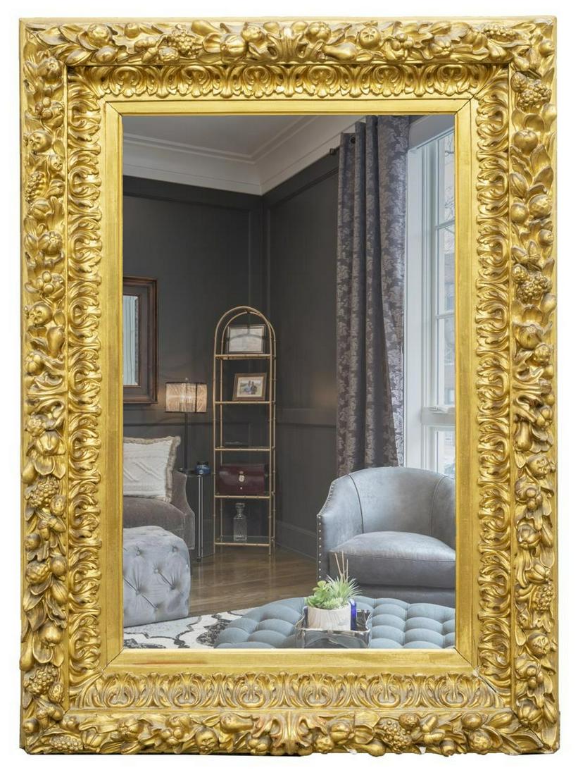 ITALIAN BAROQUE STYLE CARVED GILTWOOD MIRROR: Italian Baroque style giltwood mirror, 20th c., having extensive foliate carving to frame, housing flat rectangular mirror plate, approx 53"h, 37.5"w, 4"d Start Price: $250.00