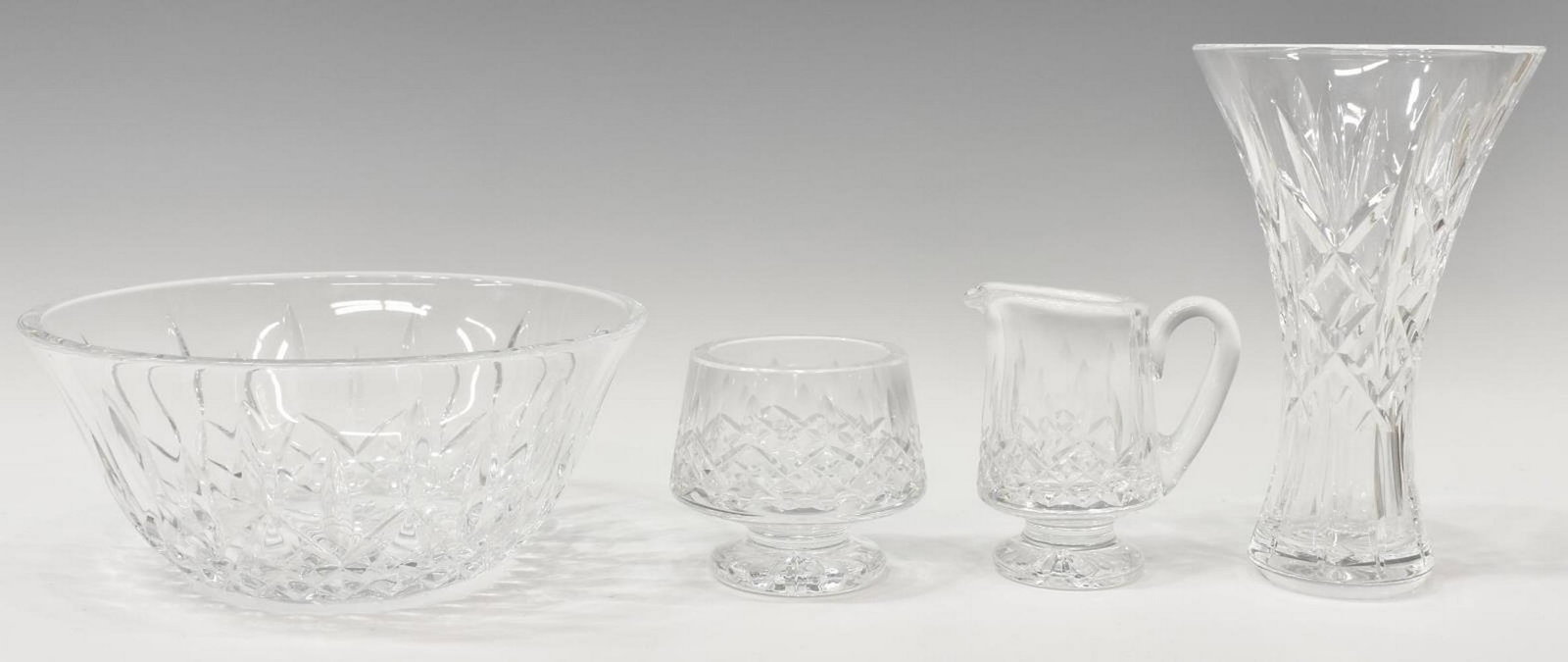 (4) WATERFORD 'LISMORE' CUT CRYSTAL TABLEWARE: (lot of 4) Waterford "Lismore" cut crystal tableware, all bearing acid etched mark underfoot, including: (1) creamer, approx 4.25"h, 3.5"diam, (1) open sugar bowl, approx 3.5"h, 3.25"diam, (1) vase, a