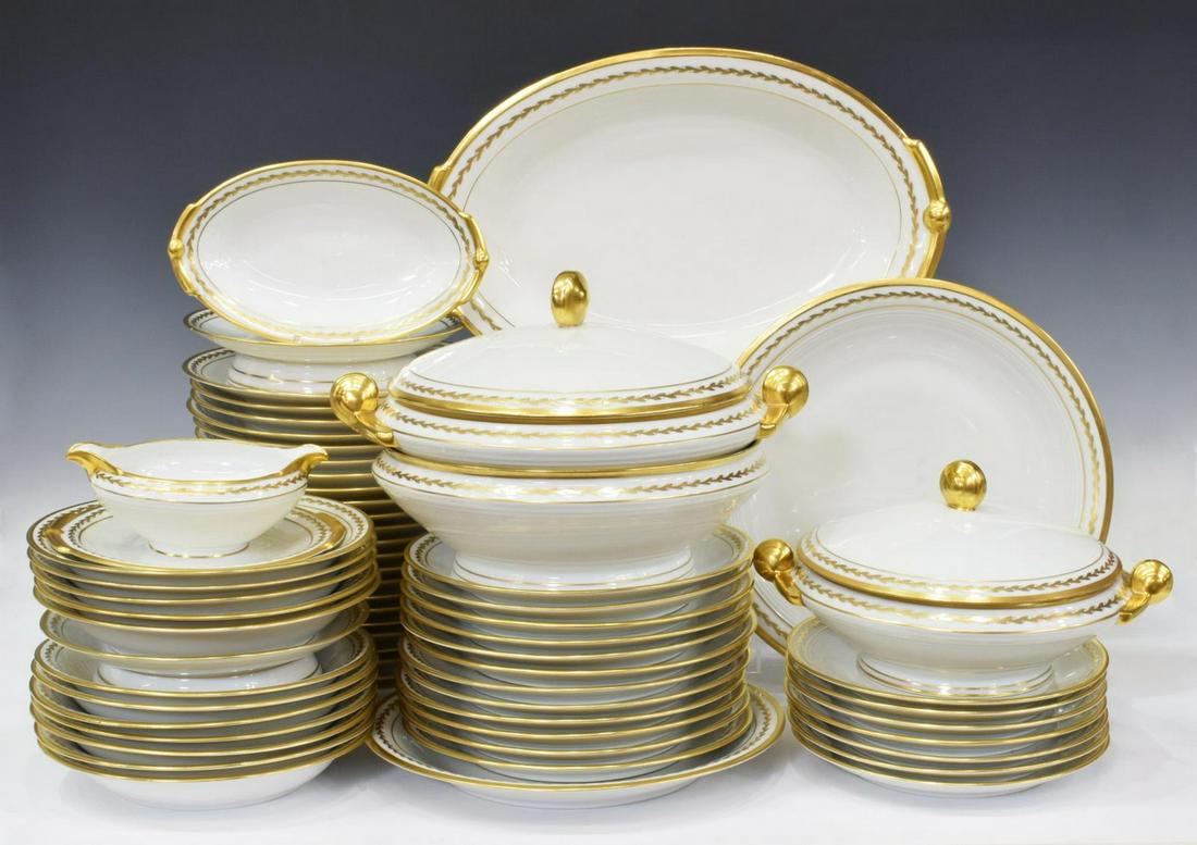 (64) G. ROSIER LIMOGES PORCELAIN DINNER SERVICE: (set of 64) French porcelain dinner service, G. Rosier Limoges, early 20th c., with parcel gilt rim and foliate border, maker's mark underfoot, including: (35) dinner plates, (one) with roughness unde