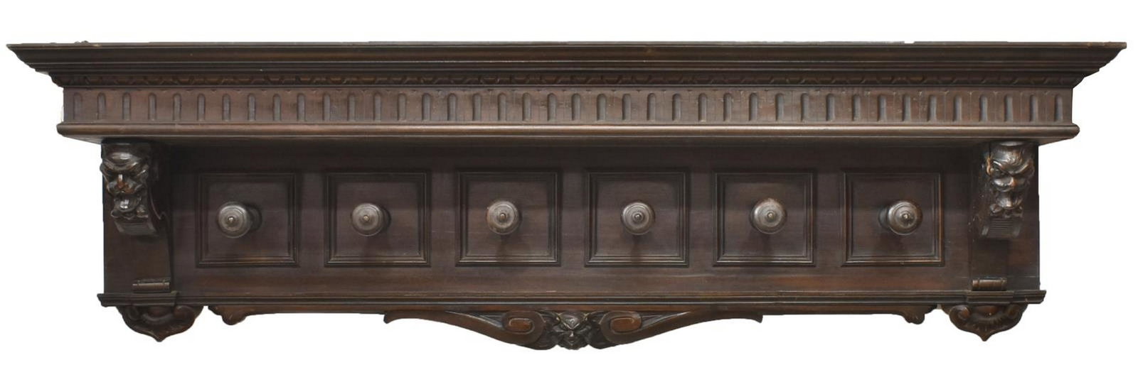 ITALIAN RENAISSANCE REVIVAL CARVED HAT RACK: Italian Renaissance Revival hanging hat rack, early 20th c., having carved running ornamentation at top, scrollwork, foliate, and grotesque mask carving, paneled back, fitted with six turned hooks, ap