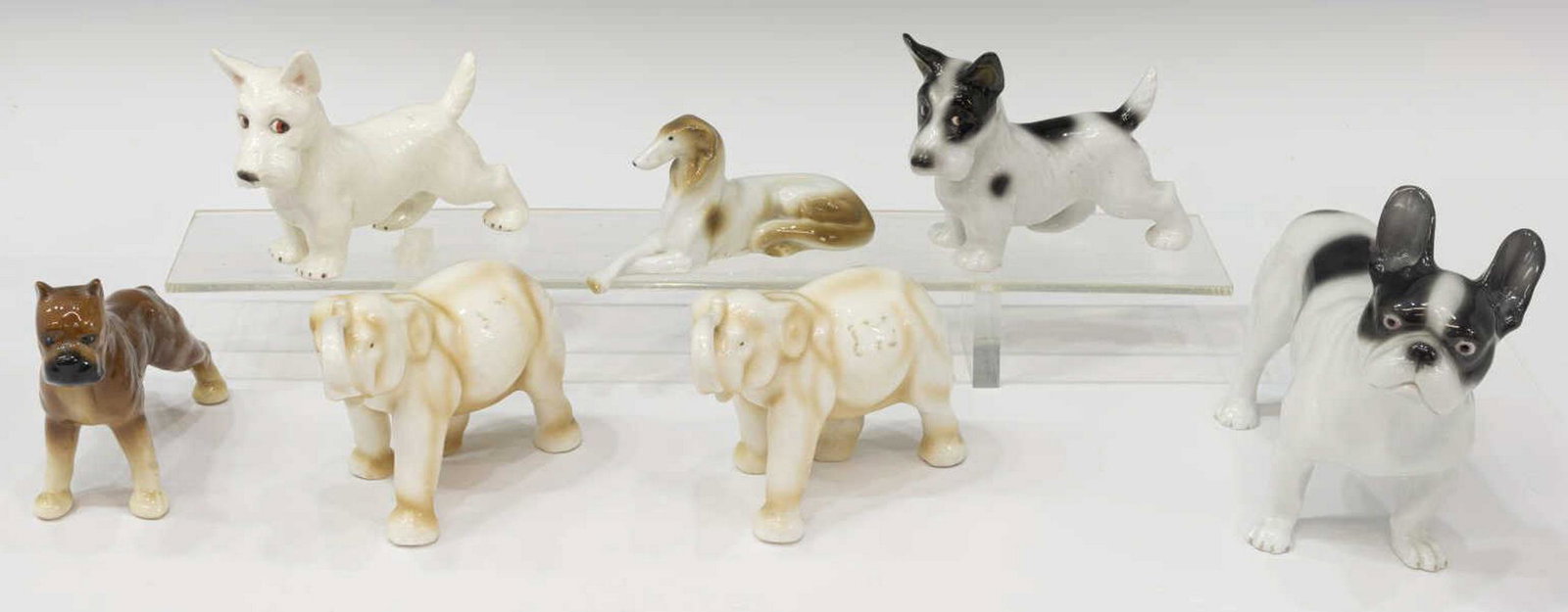 (7) GERMAN PORCELAIN DOGS, ELEPHANTS, ERPHILA: (lot of 7) German porcelain dogs and other animal figures, of various size, highlights include: (2) Erphila German porcelain elephants, in a standing pose, with trunks raised, mark underfoot, approx 4