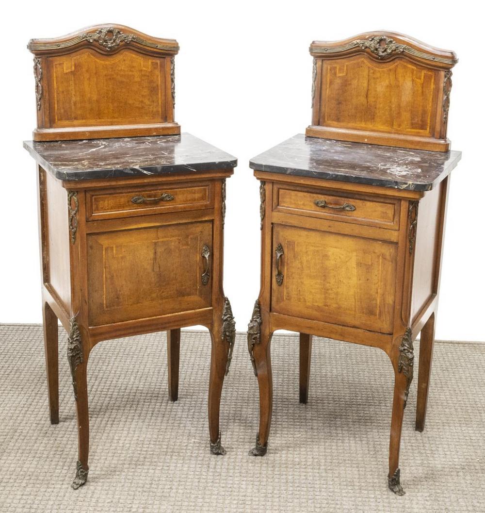 (2) LOUIS XV STYLE MARBLE-TOP BEDSIDE CABINETS: (lot of 2) Louis XV style marble-top nightstands, early 20th c., raised back over case fitted with a single drawer over cabinet door, rising on metal-mounted cabriole legs, ending in front sabots, spl