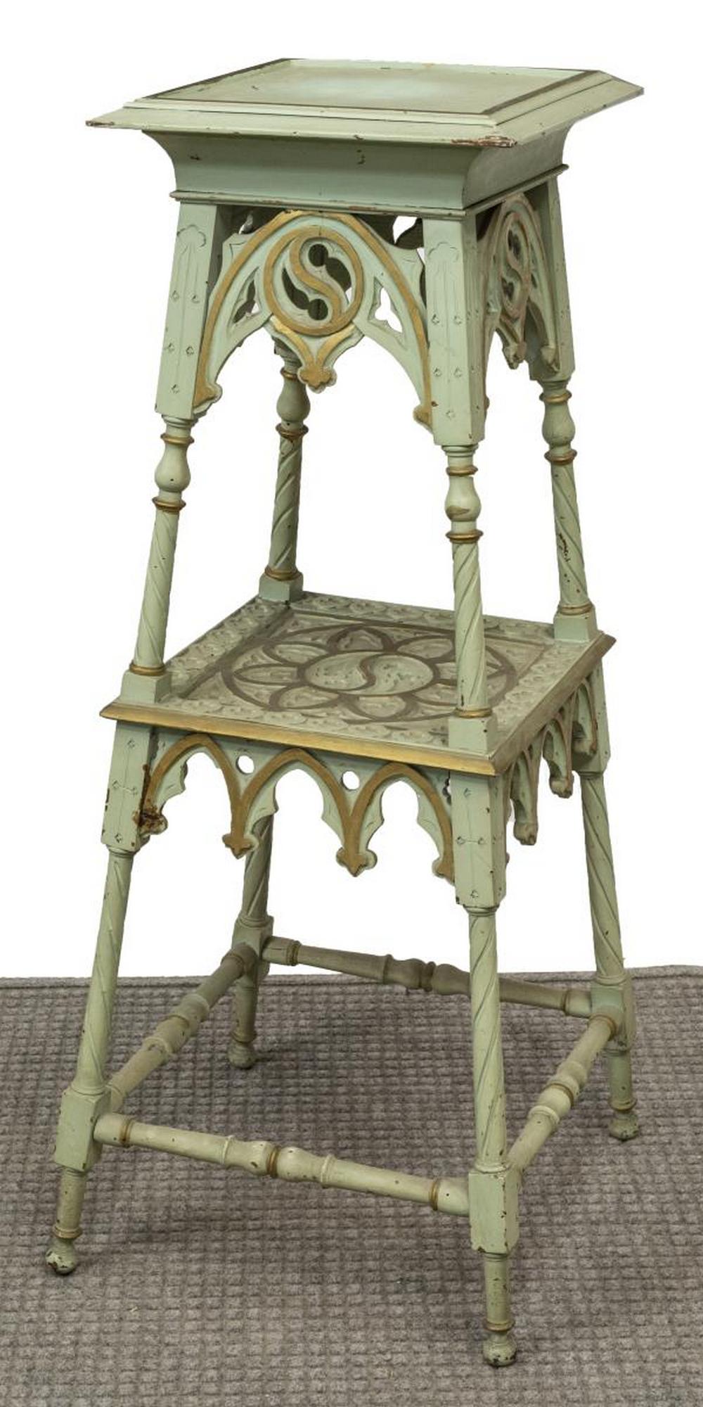 GOTHIC REVIVAL PAINTED TIERED PLANT STAND: Gothic Revival painted wood plant stand, 19th c., having worn embossed upper shelf, gilt accents, open-carved scrolling borders, medial shelf, with sun-form motif, rising on stretcher-joined turned le