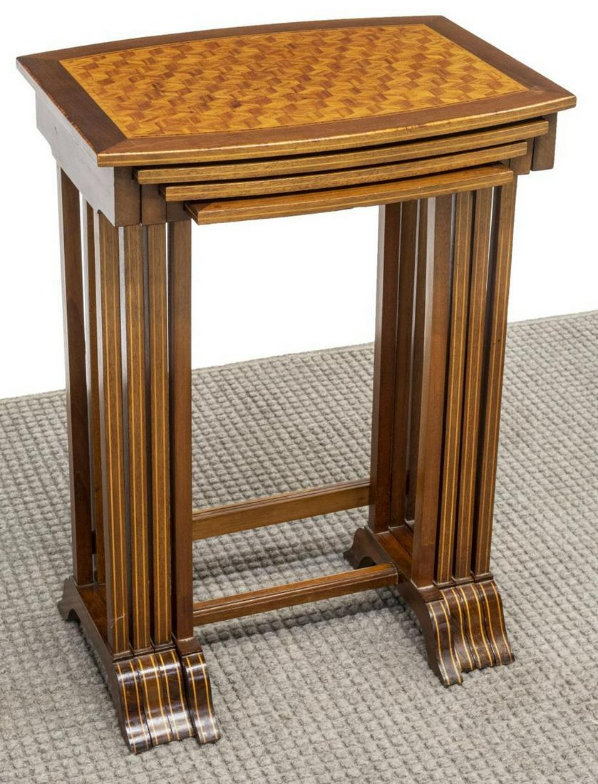 REGENCY STYLE PARQUETRY NEST OF FOUR TABLES: (lot of 4) Regency style mahogany nesting tables, 20th c., graduated sizes, with cube parquetry tabletops, rising on a trestle base, largest: approx 28.5"h, 20.5"w, 15.5"d Start Price: $150.00