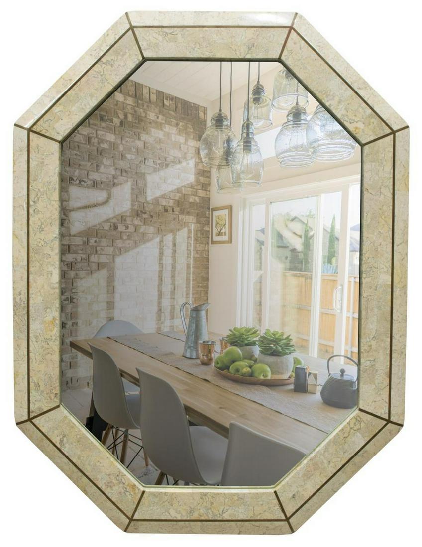 MAITLAND-SMITH STONE TILED OCTAGONAL WALL MIRROR: Maitland-Smith wall mirror, late 20th c., octagonal stone tiled frame, with brass inlay, centering beveled mirror plate, retaining label at back, small chips to frame, approx 40.5"h, 30.5"w, 32.5lbs S
