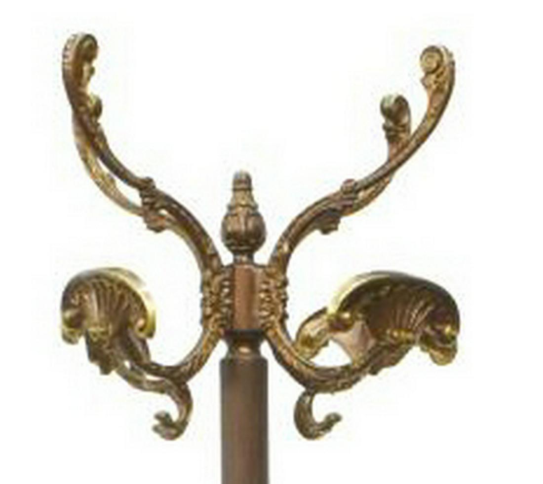 ITALIAN FOUR-HOOK STANDING HALL TREE COAT RACK: Italian standing hall tree, 20th c., having four scrolling arms, terminating in scalloped hooks, fluted central support, rising on figural tripartite base, approx 69"h, 20.5"diam Start Price: $60.00