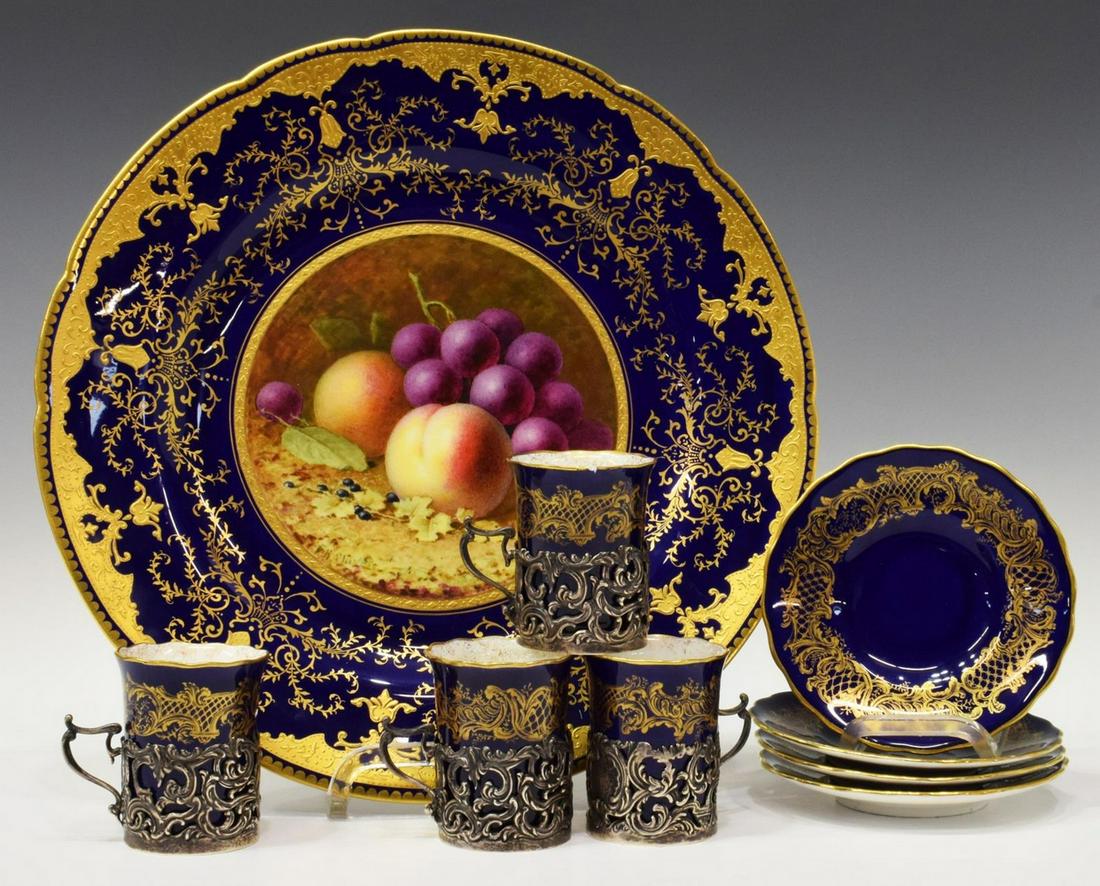 (9) COALPORT CHARGER & STERLING FRAME CUPS: (lot of 9) English Coalport parcel gilt cobalt blue porcelain tableware, comprising: (4) demitasse cups, set in sterling silver handled frames, gilt rim, scrolling motif on blue ground, approx 2.75"h,