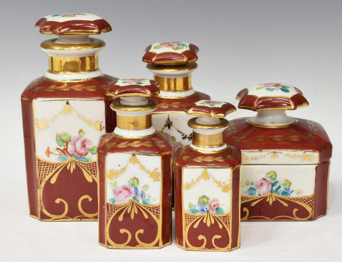 (5) FRENCH HAND-PAINTED PORCELAIN VANITY SET: (lot of 5) French porcelain vanity set, early 20th c., hand painted with floral and scrolled accents, signed underfoot, including: (4) canisters of various size, with stoppers, largest: approx 6.5"h, 