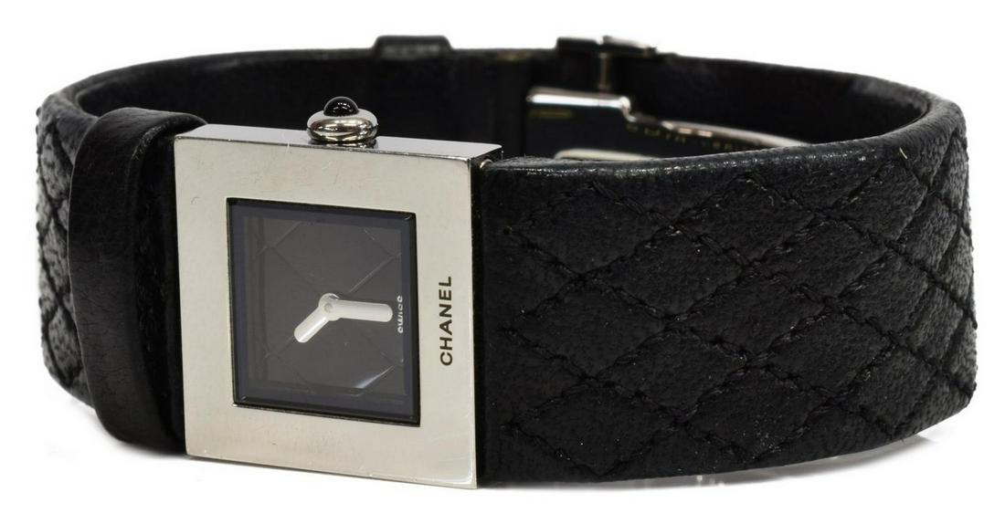 CHANEL 'MATELASSE' BLACK LEATHER WRISTWATCH: Chanel "Matelasse" watch, stainless steel with black quilted leather strap, quartz movement, back of dial marked Chanel 1993, in need of battery, some wear and marks to stainless steel and bracelet, a