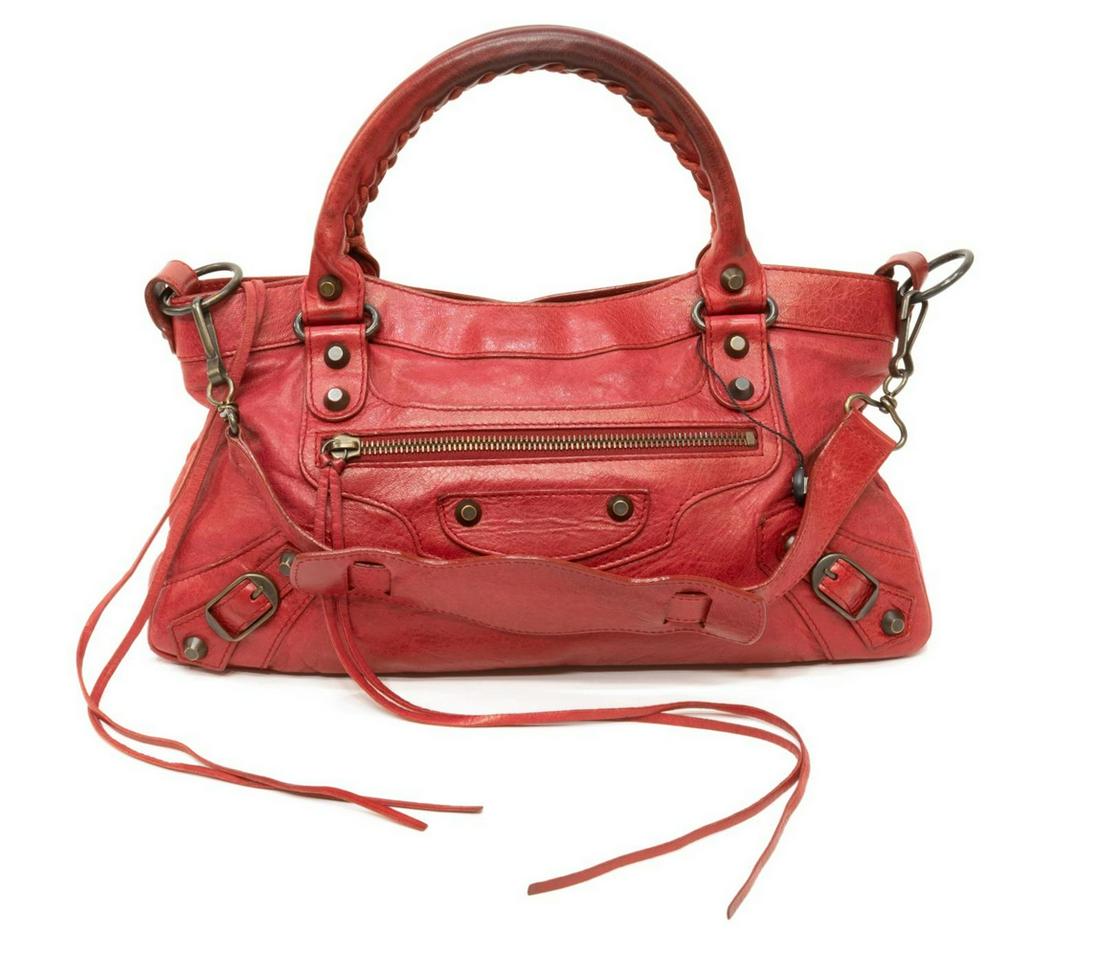 BALENCIAGA 'MOTOCROSS' RED ARENA LEATHER HANDBAG: Balenciaga "Motocross" handbag, in red arena leather, with brass hardware, dual rolled handles with stitched accent, exterior zip pocket, zip closure at top opening to black fabric interior with singl