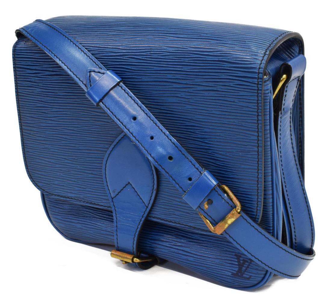 LOUIS VUITTON 'CARTOUCHIERE' EPI CROSSBODY BAG: Louis Vuitton "Cartouchiere" crossbody bag, in blue Epi leather, with brass hardware, adjustable flat shoulder strap, buckle closure at front flap opening to leather lined interior split in two sectio