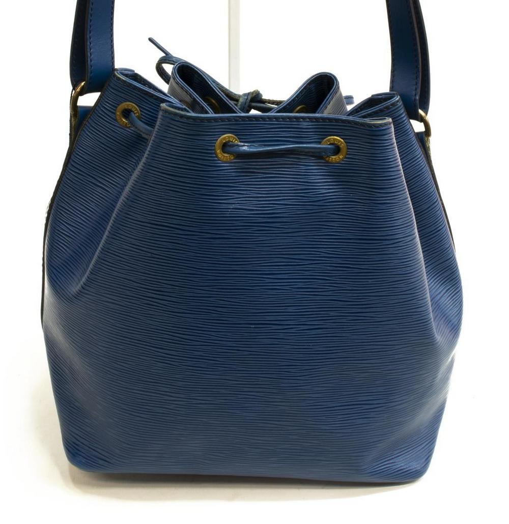 LOUIS VUITTON 'NOE PM' BLUE EPI LEATHER BUCKET BAG: Louis Vuitton "Noe PM" bucket bag, in blue Epi leather with black stitching, brass hardware, adjustable flat shoulder strap, drawstring closure at front face opening to black Alcantara lined interior,