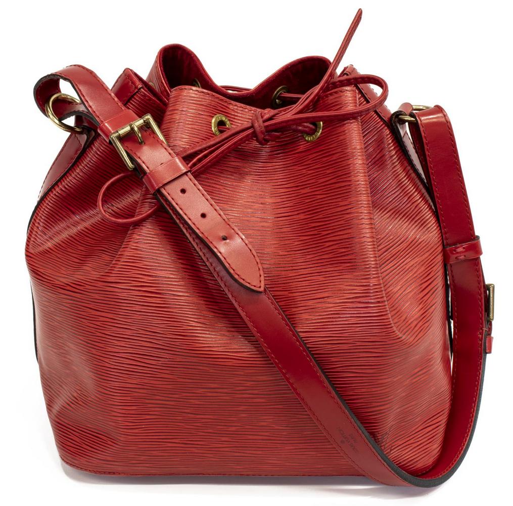LOUIS VUITTON 'NOE' RED EPI LEATHER BUCKET BAG: Louis Vuitton "Noe" bucket bag, in red Epi leather, with brass hardware, adjustable flat shoulder strap, drawstring closure at front face, opening to tonal Alcantara lined open interior, creasing, sli