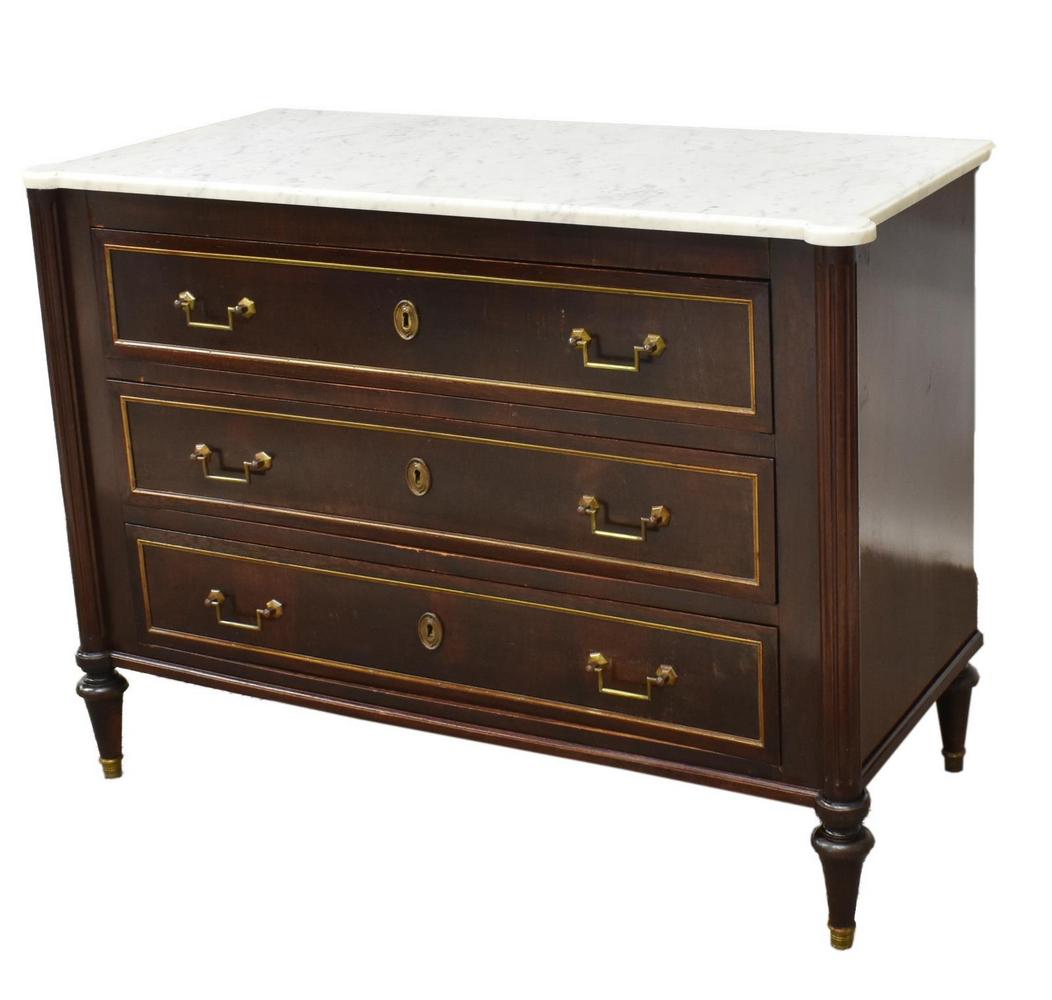 FRENCH LOUIS XVI STYLE MARBLE-TOP MAHOGANY COMMODE: French Louis XVI style marble-top commode, 19th c., a white marble top, resting on the mahogany case, fitted with three drawers, fluted columnar uprights, rising on tapered conical supports, ending in