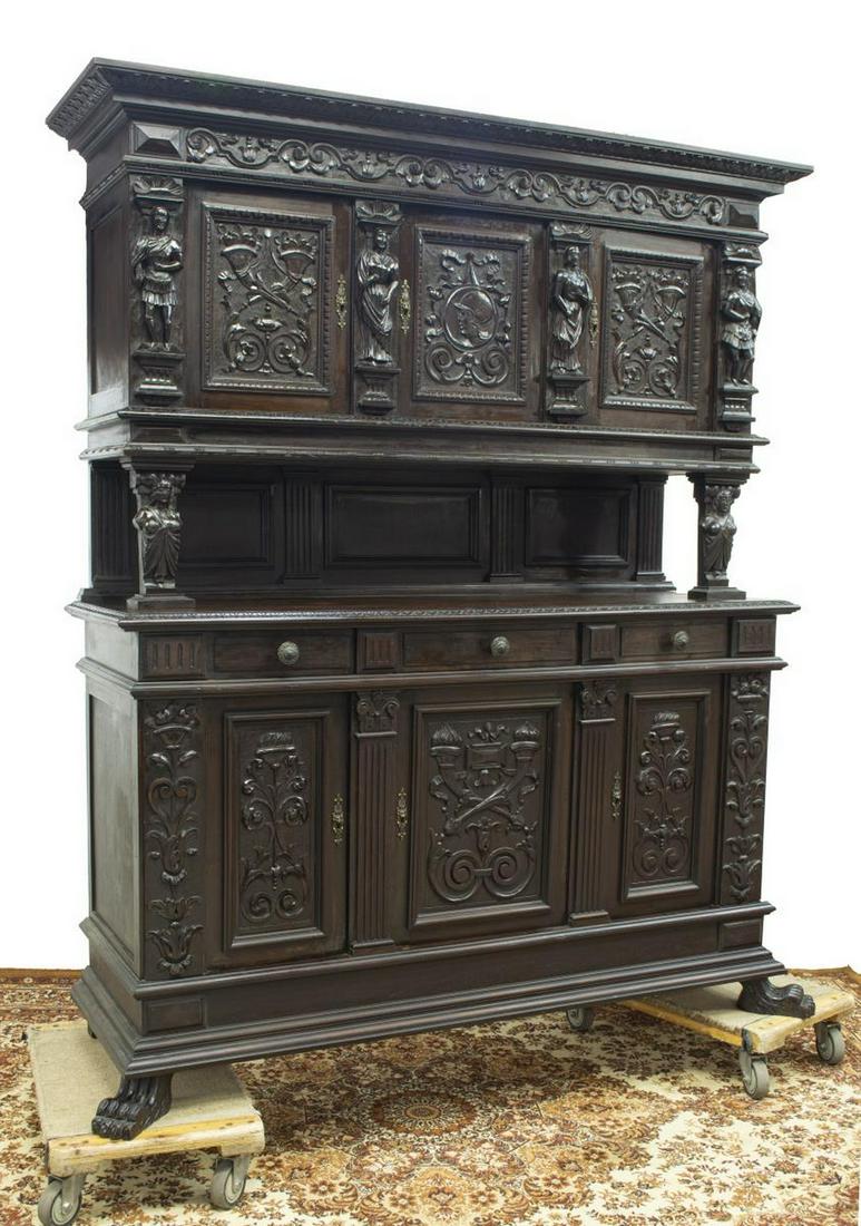 ITALIAN RENAISSANCE REVIVAL CARVED SIDEBOARD: Italian Renaissance Revival sideboard, early 20th c., the upper part with foliate carved cornice and frieze over three figural, cornucopia, and foliate carved panels separated by figural faced pilaste