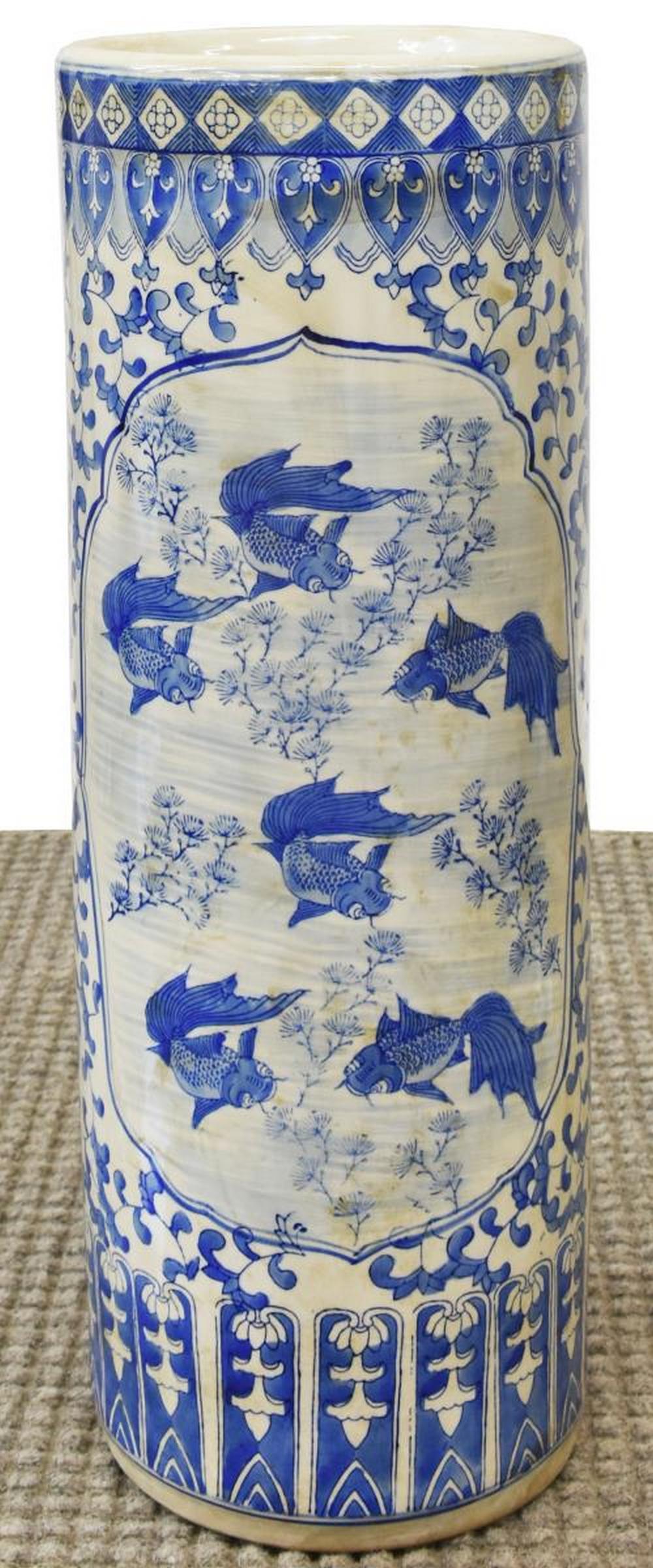 CHINESE BLUE & WHITE PORCELAIN UMBRELLA STAND: Chinese blue and white porcelain umbrella stand, having foliate motifs, central reserve depicting Koi fish and foliage, approx 25.5"h, 9.5"d, 14.85lbs Start Price: $60.00