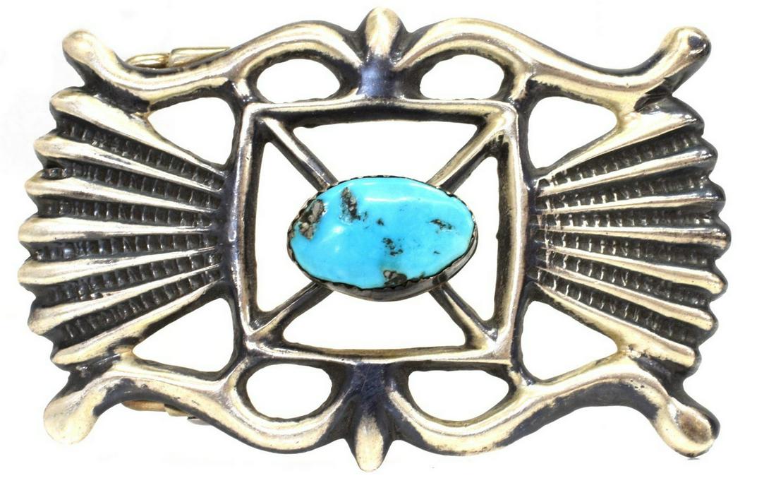 NATIVE AMERICAN SILVER & TURQUOISE BELT BUCKLE: Native American tufa cast silver (content unknown) belt buckle, likely Navajo, with central bezel-set turquoise cabochon, approx 1 7/8"h, 2 7/8"w, 43 grams (inclusive of all materials) Start Price: $8