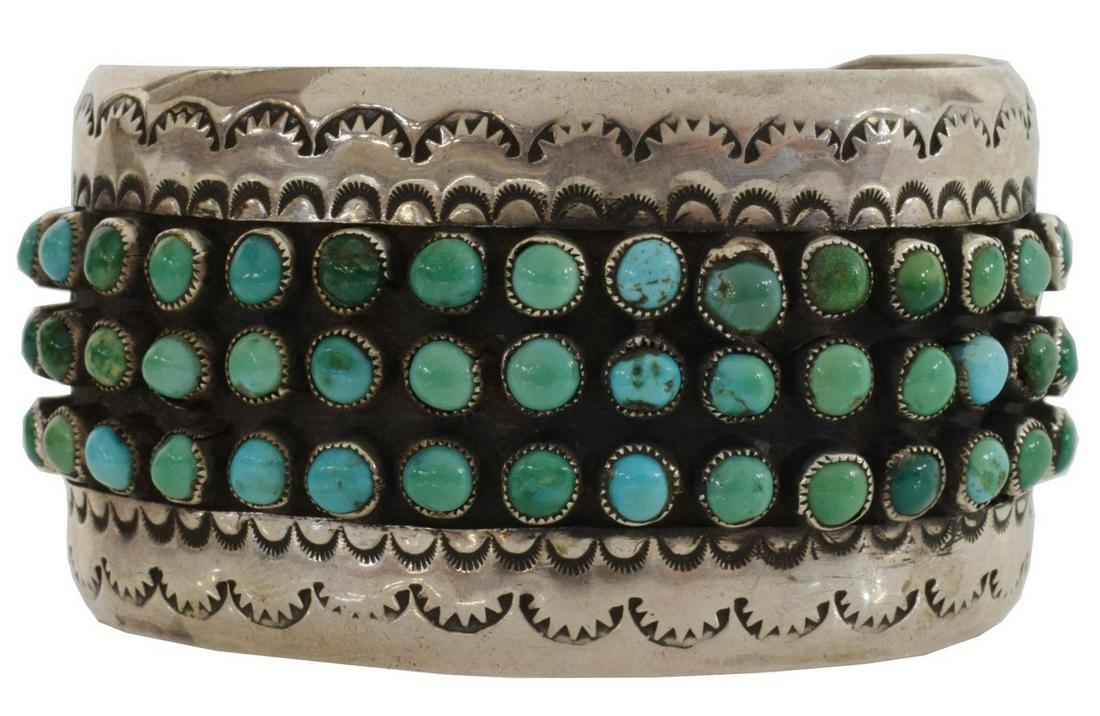 NATIVE AMERICAN SILVER TURQUOISE PETIT POINT CUFF: Native American silver (content unknown) cuff bracelet, with turquoise cabochons in petit point design, stamped cuff, approx 1.5"w, interior: (end to end) approx 6"l, gap: approx 1.25"w, 62.5 grams (i