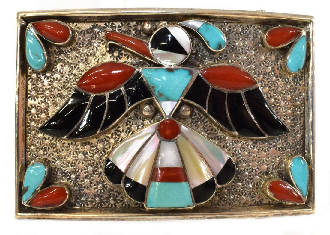 ZUNI MULTI STONE INLAID THUNDERBIRD BELT BUCKLE: Native American Zuni silver (content unknown) belt buckle, thunderbird inlaid with turquoise, jet, red coral and mother of pearl, on stamped ground, approx 2"h, 3"w, 66 grams (inclusive of all materia