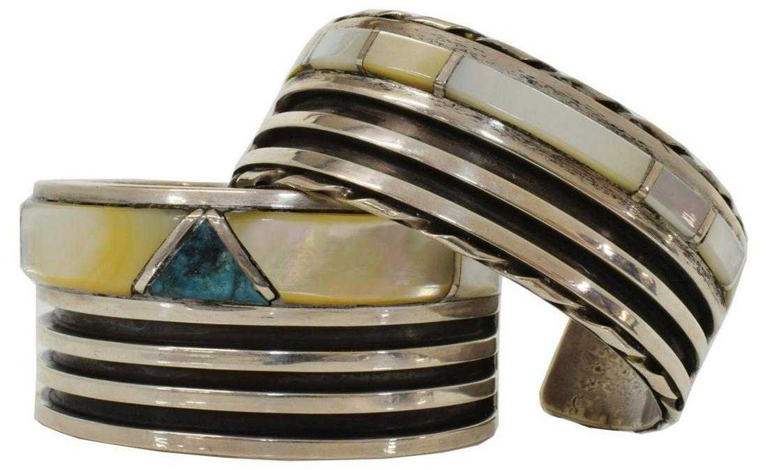 (2) NATIVE AMERICAN SILVER RIBBED & INLAID CUFFS: (lot of 2) Native American silver (content unknown) cuff bracelets, likely Zuni, each with ribbed design and inlaid mother of pearl, comprising: (1) with triangular central inlaid turquoise stone, app