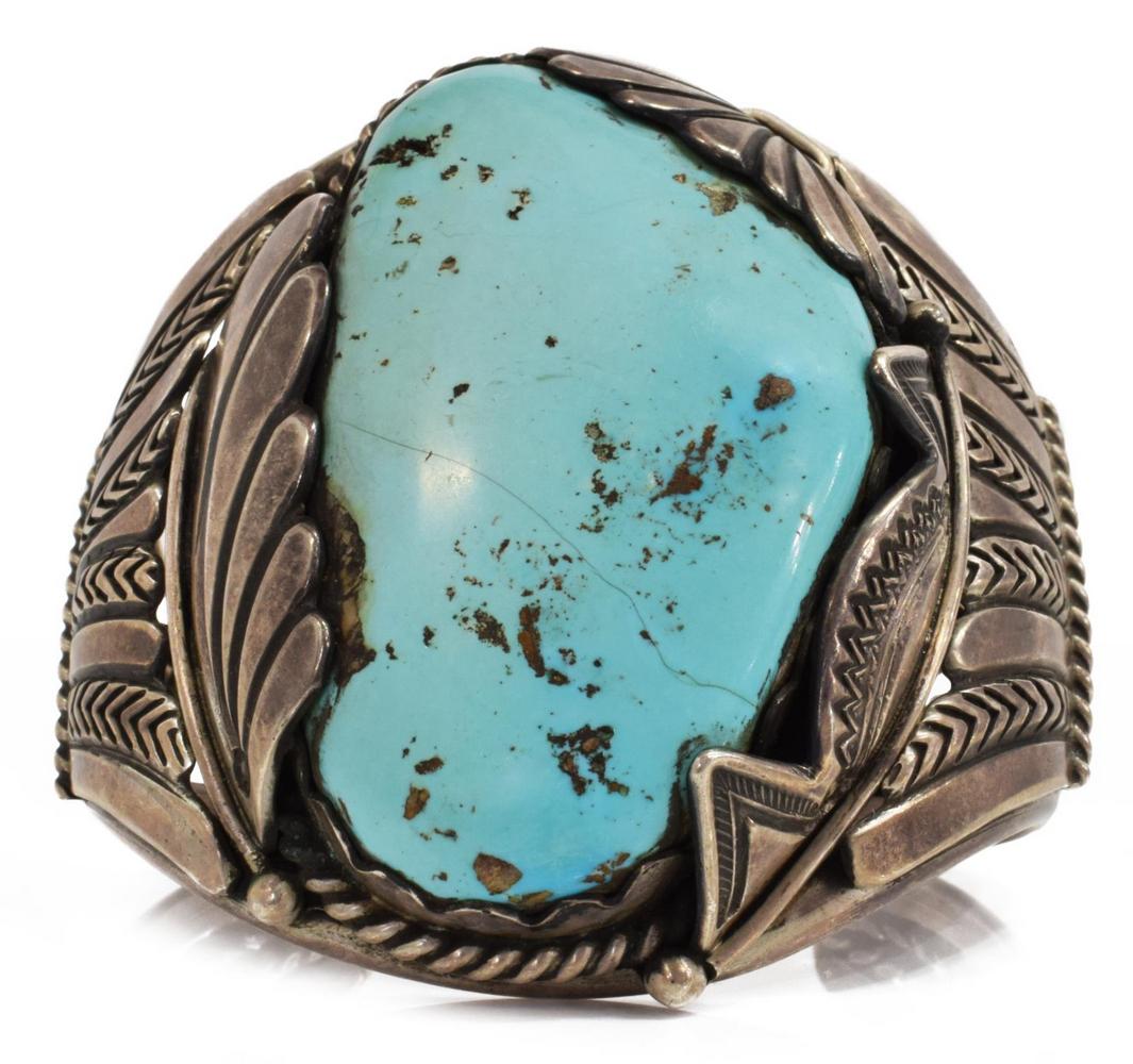 FRED THOMPSON NAVAJO TURQUOISE STERLING CUFF: Native American sterling silver cuff bracelet, Fred Thompson (Navajo, 1921-2002), central turquoise cabochon, worked cuff with split shank, picto hallmark, stone intact with hairline, approx 2 3/8"w, 