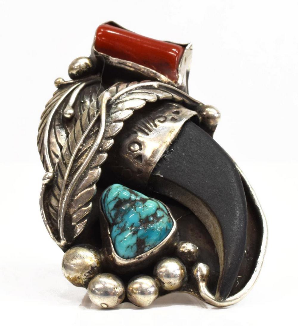 SHOP LES BAKER STERLING CORAL & TURQUOISE RING: Southwest sterling, coral and faux bear claw ring, Les Baker (1935-2014) Workshop, feather and bead motif, on a wide band, approx size 8.25, 30 grams (inclusive of all materials)**Provenance: from the
