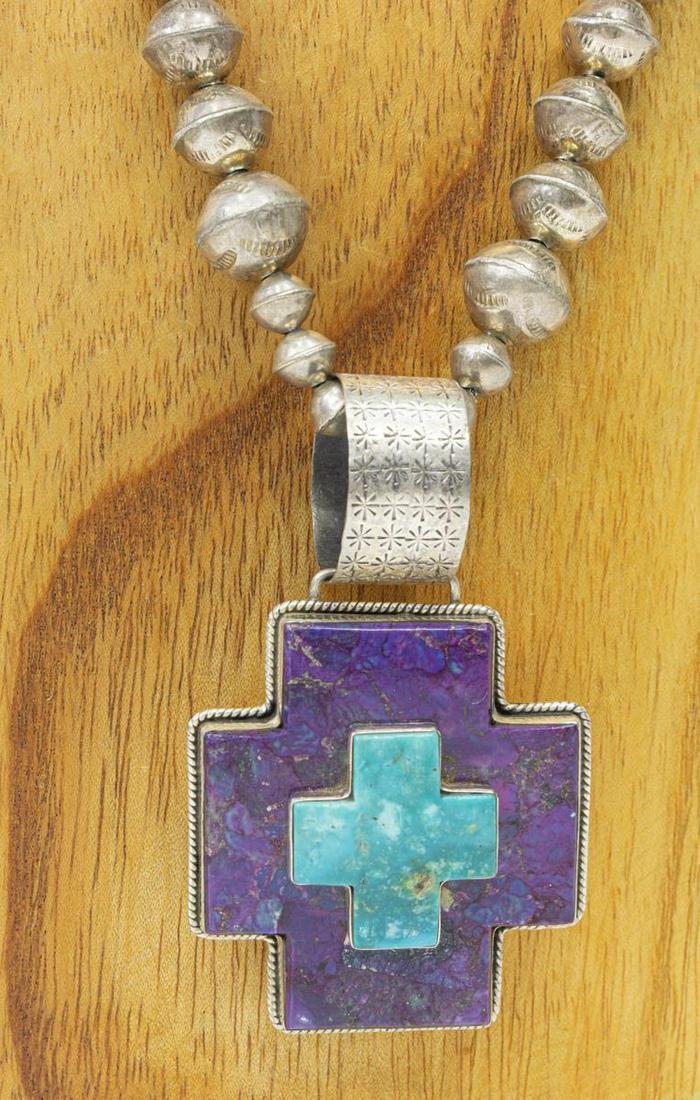 SOUTHWEST DAN DODSON CROSS PENDANT NECKLACE: Southwest silver (content unknown) pendant necklace, sterling cross pendant with purple sugilite and turquoise, signed Dan Dodson (Santa Fe, 20th c.), on an assembled, graduated bench bead strand with