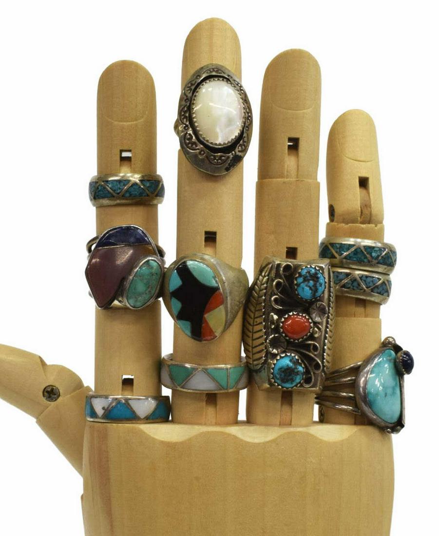 (10) NATIVE AMERICAN TURQUOISE, CORAL & MOP RINGS: (lot of 10) Native American silver (content unknown) rings, inlaid with various stones including turquoise, red coral, mother of pearl, etc., comprising: (1) hallmarked AR with an arrow, centering mot