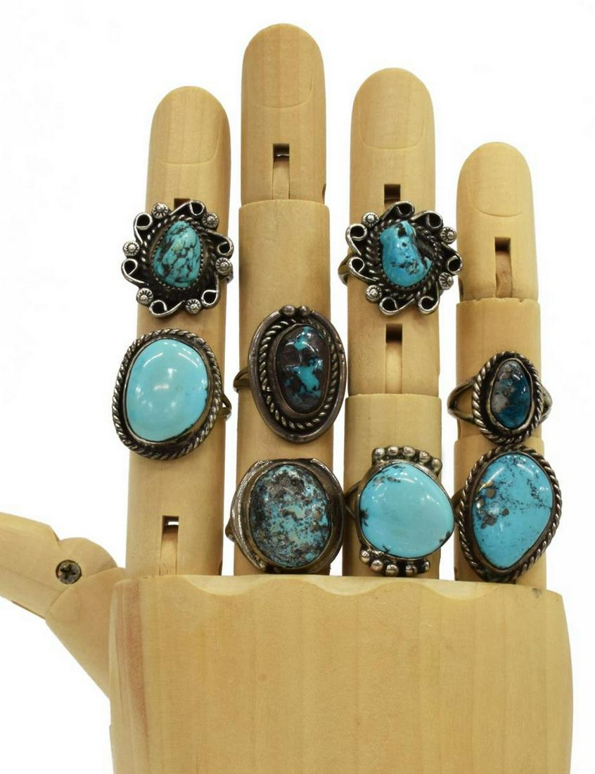 (8) NATIVE AMERICAN SILVER & TURQUOISE RINGS: (lot of 8) Native American silver (content unknown) rings, each with central bezel-set turquoise stone, sizes range from approx 5.25 to 7.5, 49.5 grams total (inclusive of all materials) **Provenance: