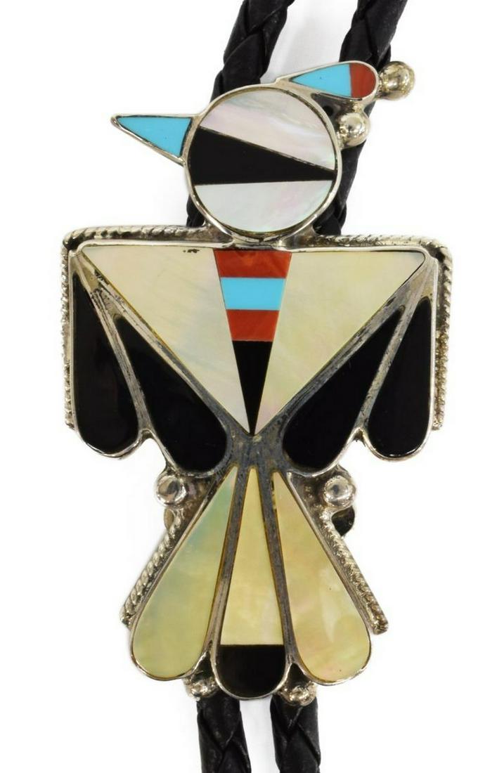 NATIVE AMERICAN ZUNI INLAID THUNDERBIRD BOLO TIE: Native American sterling silver bolo tie, signed MW, possibly Mabel Watson (Zuni, 20th c.), multi stone inlay thunderbird with turquoise, red coral, mother of pearl, and jet, silver bolo tips with inl