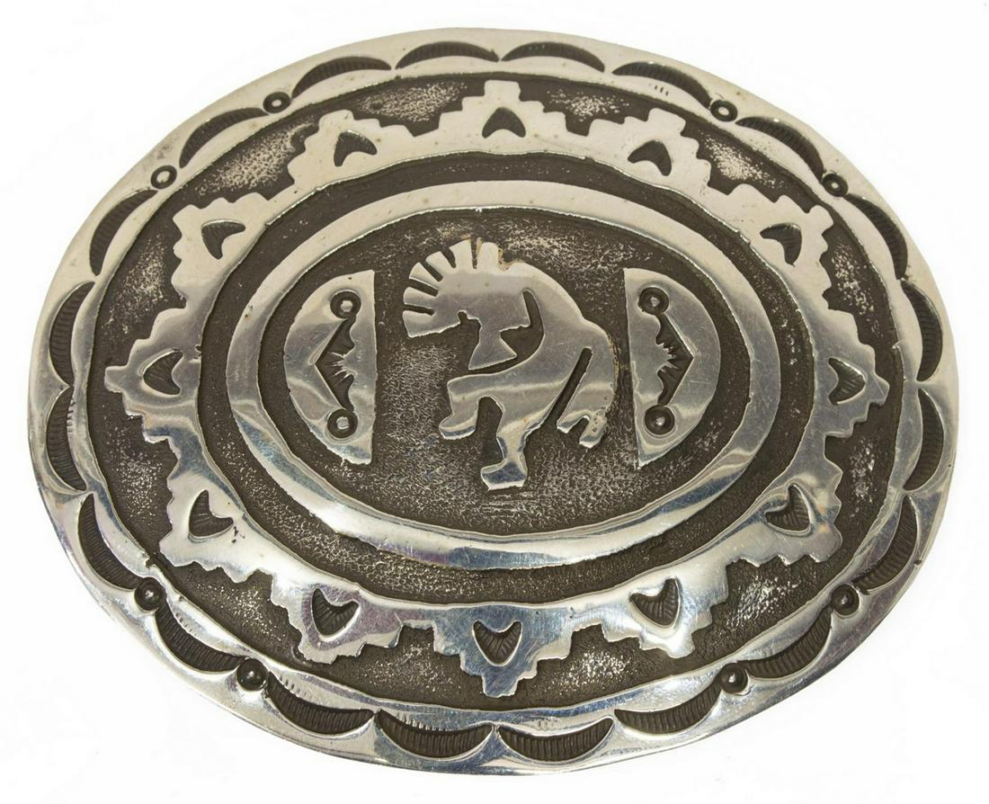 BEATRICE KEE NAVAJO STERLING KOKOPELLI BELT BUCKLE: Native American sterling silver belt buckle, hallmarked BK (Beatrice Kee, Navajo, 20th c.), central Kokopelli figure amidst geometric motif, approx 3"l, 3.75"w, 61.5 grams (inclusive of all materials)