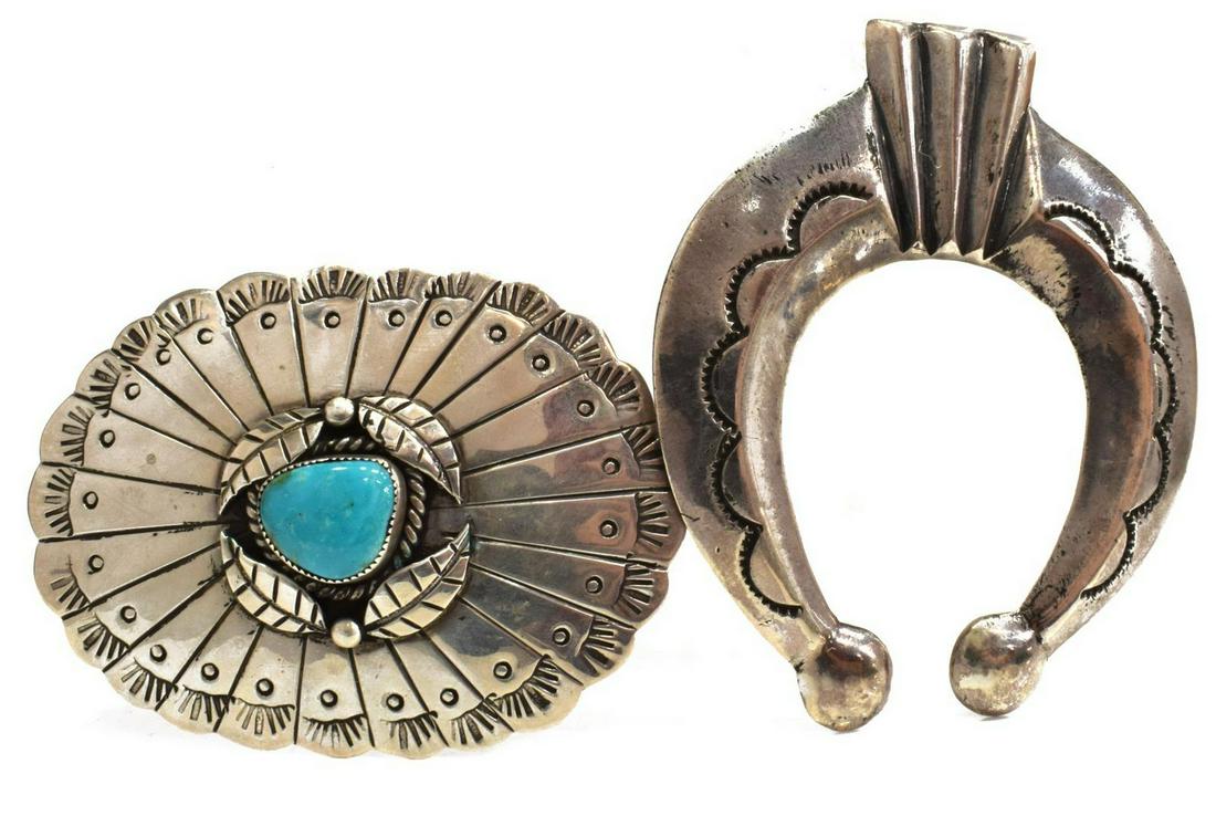 (2) NATIVE AMERICAN SILVER NAJA PENDANT & BUCKLE: (lot of 2) Native American silver (content unknown) jewelry, including: (1) naja pendant, stamped design, approx 3.25"h, 2.75"w, (1) belt buckle, central turquoise cabochon, approx 2 1/8"h, 2 7/8"w; 9