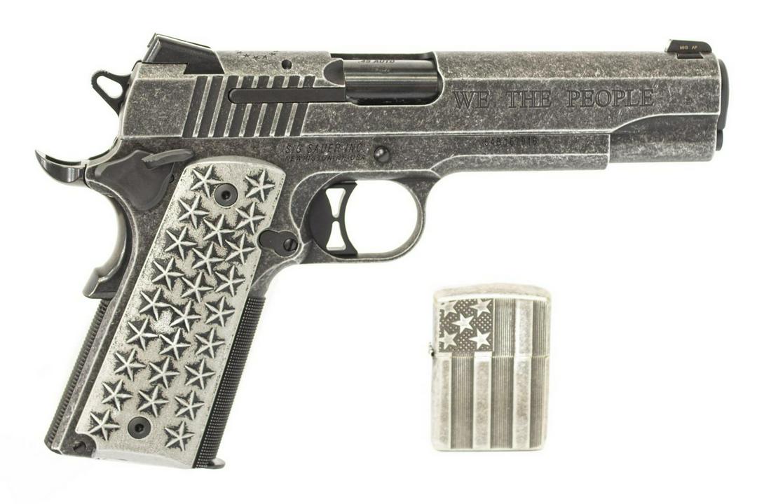 SIG SAUER M1911 '1776, WE THE PEOPLE' .45 PISTOL: Sig Sauer Model 1911 Commemorative Pistol, engraved at left and right slide "1776, We The People," .45 caliber, 5" barrel, gray steel finish, the gray grips with 25 raised stars at each side, glass to