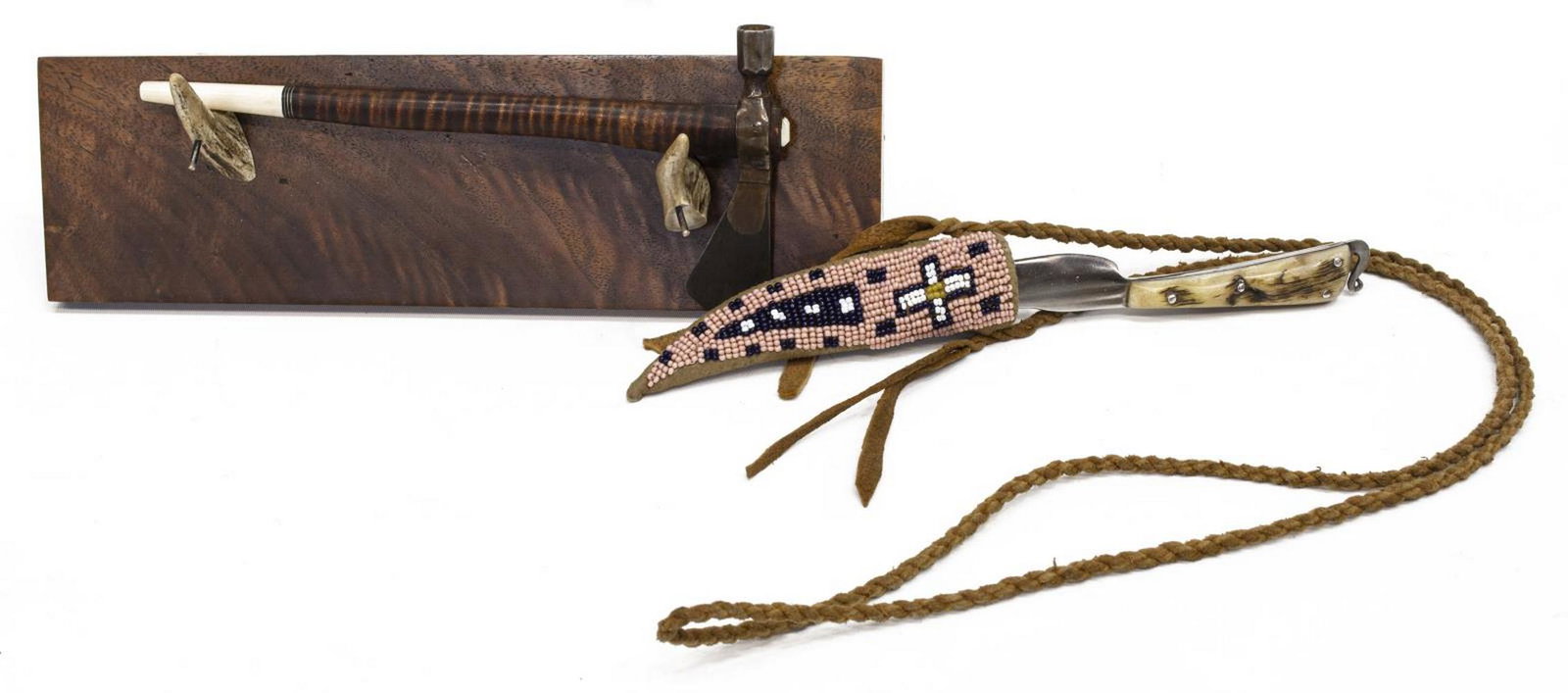 (2) MINIATURE CUSTOM-MADE TOMAHAWK PIPE & KNIFE: (lot of 2) Custom-made knife and mini tomahawk, both with impressed logo depicting open wing bird; (1) fixed 2.5" blade knife with stag like handle, housed in beaded leather sheath, knife overall: 5.2