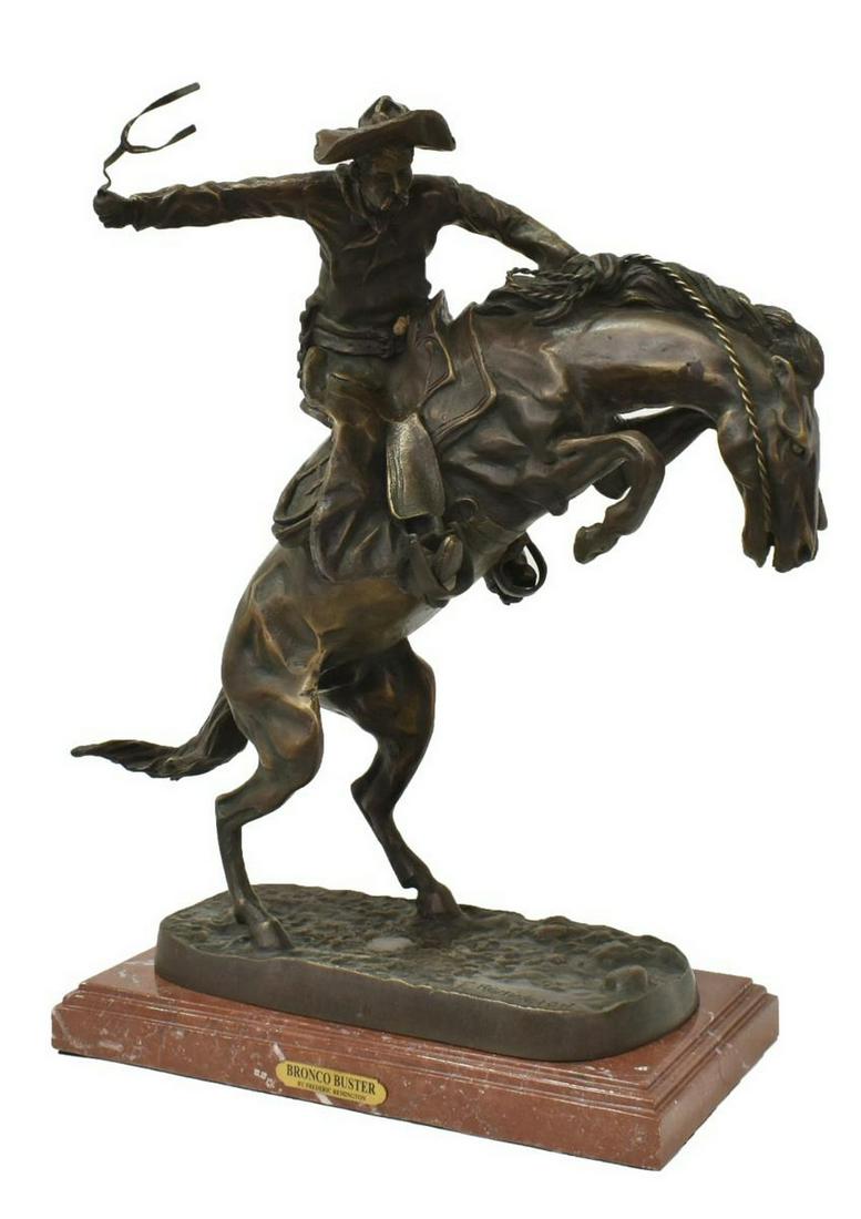 AFTER FREDERIC REMINGTON (1861-1909) BRONCO BUSTER: Bronze sculpture on marble, Bronco Buster, after the original by Frederic Remington (American, 1861-1909), approx 22"h, 19"w, 13"d, 39.25lbs Start Price: $200.00