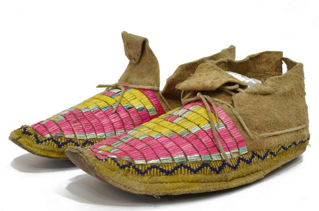 (PR) NATIVE AMERICAN QUILLED & BEADED MOCCASINS: (pair) Northern Plains hide moccasins, c. 1910-1930, brightly dyed pink and yellow quilled design, beaded border, approx 4"h, 10.5"l, 3.75"w; 0.60lbs total Start Price: $250.00