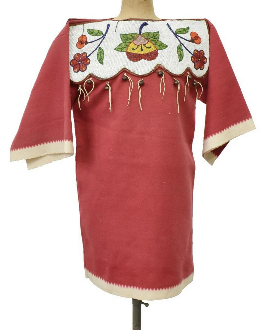 NATIVE AMERICAN PLATEAU BEADED TRADE CLOTH DRESS: Native American child's trade cloth dress, Plateau, c.1910-1930, red and white wool trade cloth dress featuring beaded bodice with white, green, blue, red and yellow glass beads in a naturalistic flor