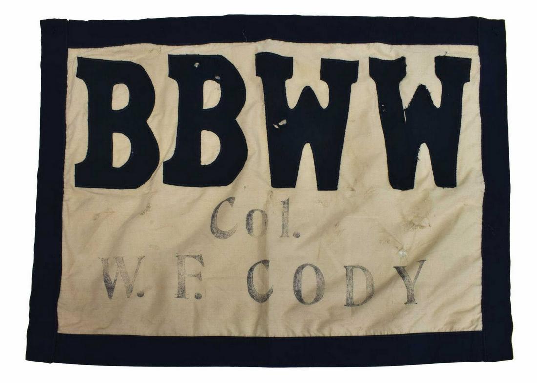 BUFFALO BILL WILD WEST CLOTH SHOW BANNER: Reproduction, Buffalo Bill Wild West cloth show banner, reading BBWW in blue stitched on 9" high letters on the white field over the stenciled letters Col. W.F. Cody, possibly later blue border, sever